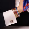 Agama Red & Gold Hinged Enamel Bangle | Halcyon Days
